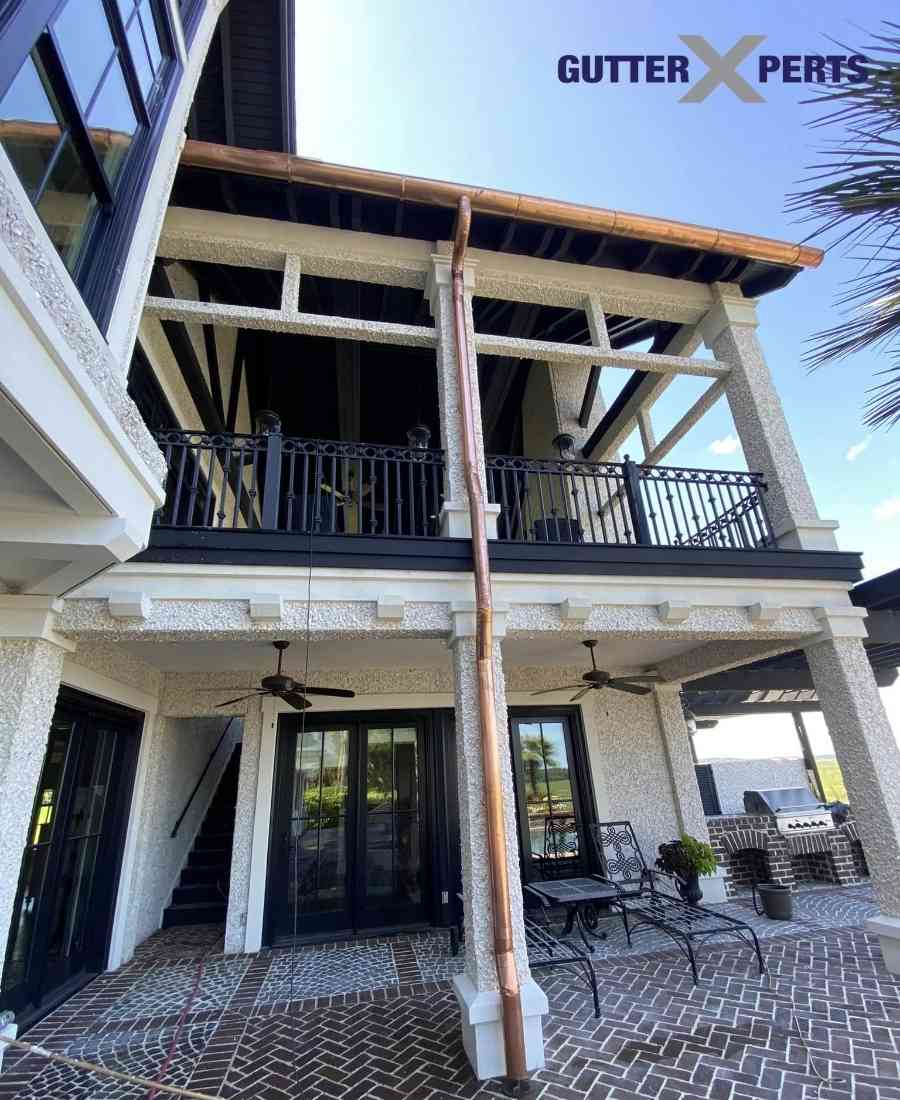 Close‑up of GutterXperts Copper gutter guard protecting against leaves and debris in Beaufort County.