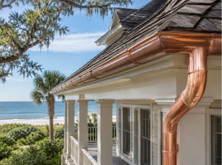 Luxury Hilton Head SC oceanfront home with copper gutters showing natural patina development and coastal Lowcountry architecture